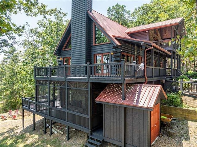 1363 Foxhound Trl, Ranger, GA 30734 - rear view of property featuring a metal roof, a chimney, and a deck