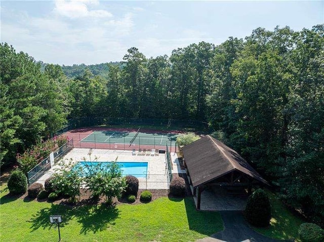 1363 Foxhound Trl, Ranger, GA 30734 - aerial view of property and surrounding area featuring a forest and a pool area
