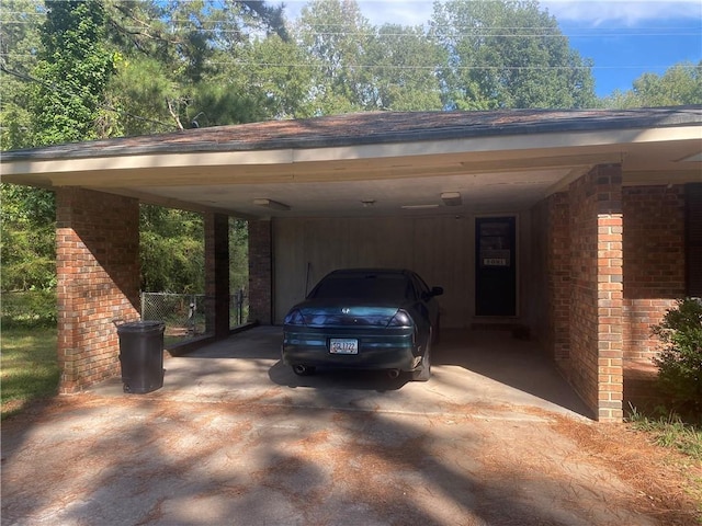 view of parking / parking lot featuring a carport