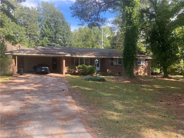 single story home featuring a front lawn and a carport