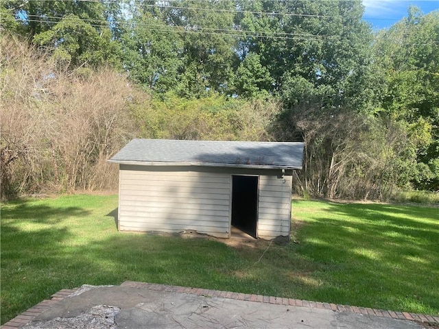 view of outbuilding with a lawn