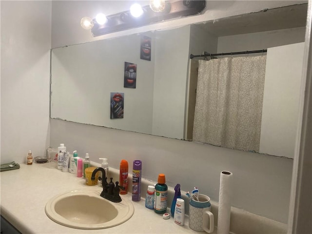 bathroom with vanity and curtained shower