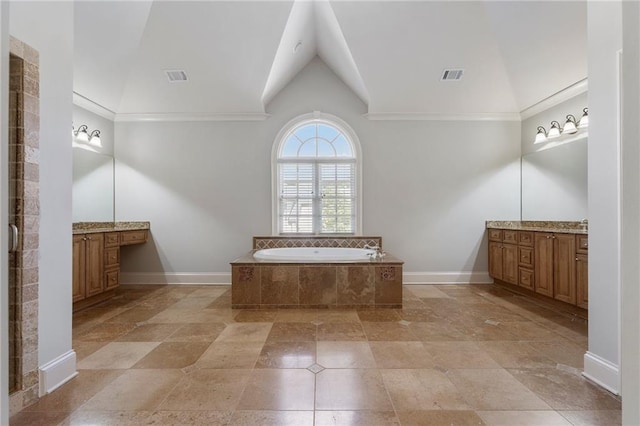 bathroom with lofted ceiling, crown molding, a relaxing tiled tub, and vanity