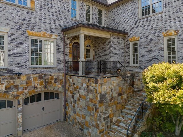 doorway to property featuring a garage