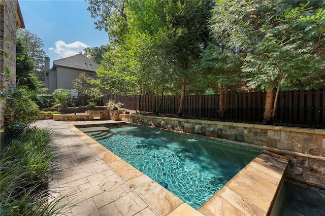 view of swimming pool featuring a patio and pool water feature