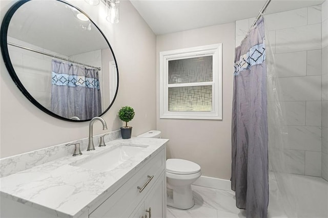 full bathroom with toilet, marble finish floor, vanity, and baseboards