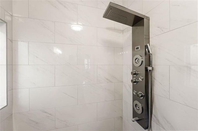 full bathroom with tiled shower