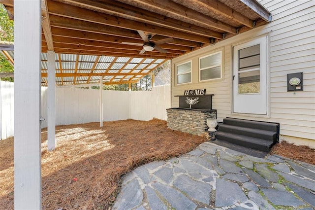 view of patio / terrace featuring a ceiling fan, entry steps, and fence