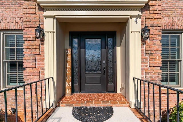 entrance to property with brick siding