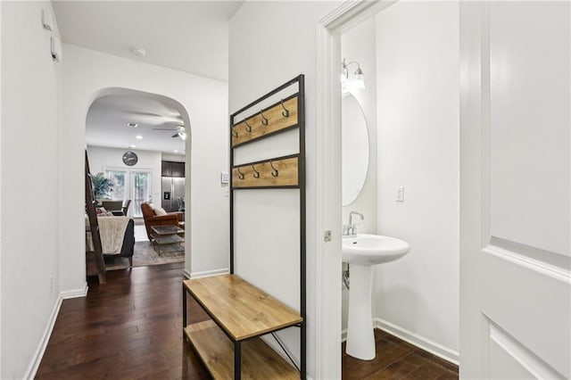 bathroom featuring hardwood / wood-style flooring and ceiling fan