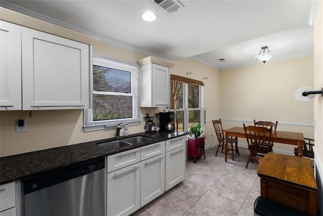 kitchen with light tile patterned floors, a sink, visible vents, dishwasher, and crown molding