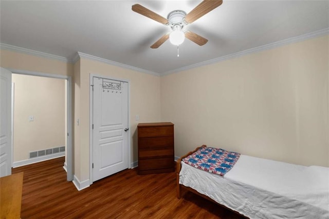 bedroom with baseboards, visible vents, a ceiling fan, ornamental molding, and wood finished floors