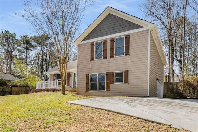 back of property featuring a yard, a patio area, and fence