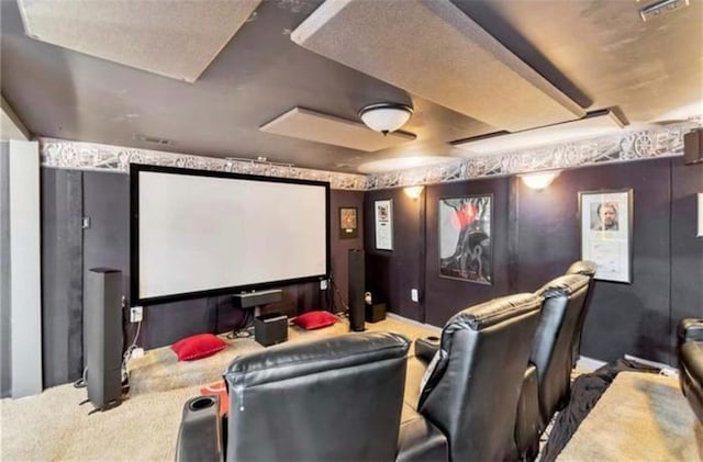 carpeted home theater room with visible vents