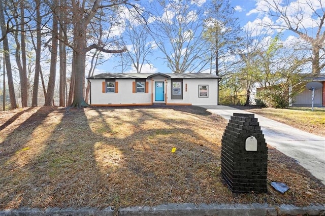 ranch-style house with a front lawn