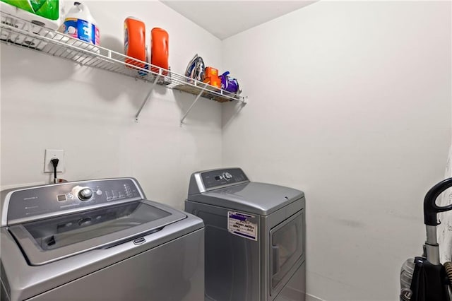 washroom with laundry area and washing machine and clothes dryer