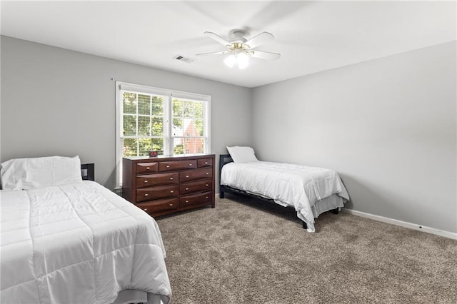 bedroom with visible vents, carpet flooring, baseboards, and ceiling fan