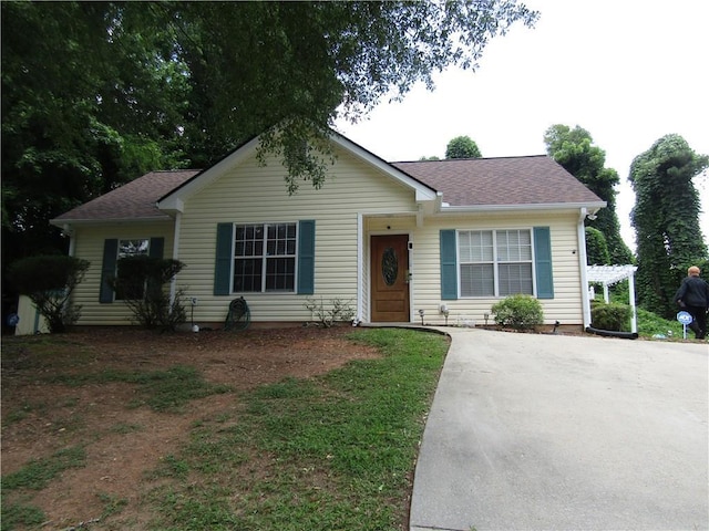 274 Griffith St, Winder, GA 30680 - view of front of property with driveway, roof with shingles, and a pergola
