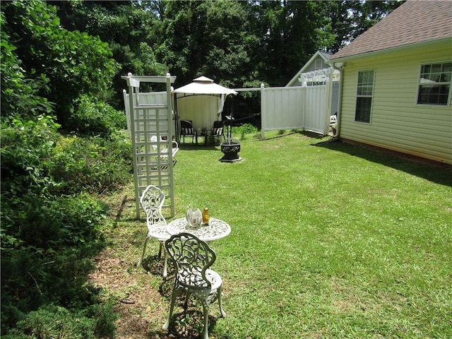 274 Griffith St, Winder, GA 30680 - view of yard with an outdoor fire pit