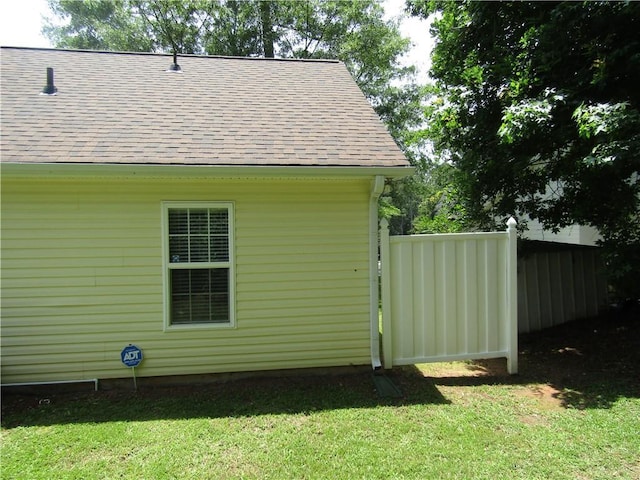 274 Griffith St, Winder, GA 30680 - view of side of property with roof with shingles and a lawn