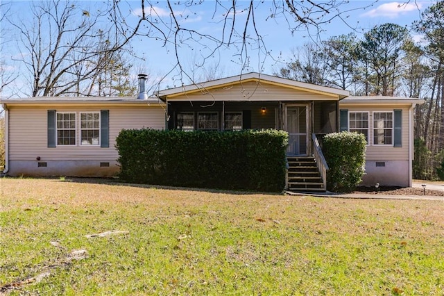 view of front facade with crawl space and a front yard