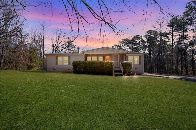 single story home with crawl space and a front yard