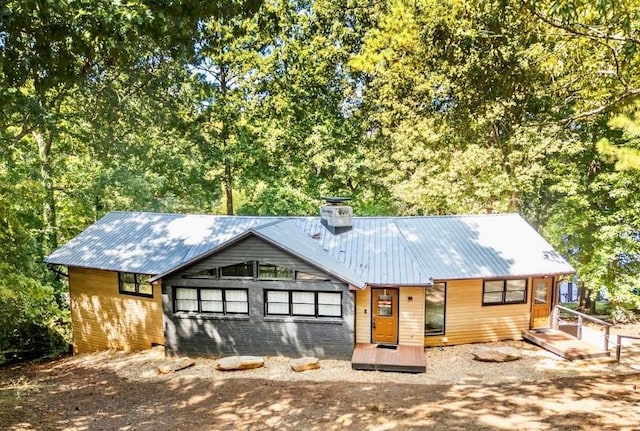 1019 Whippoorwill Rd, Monticello, GA 31064 - view of front of house with a metal roof and a chimney
