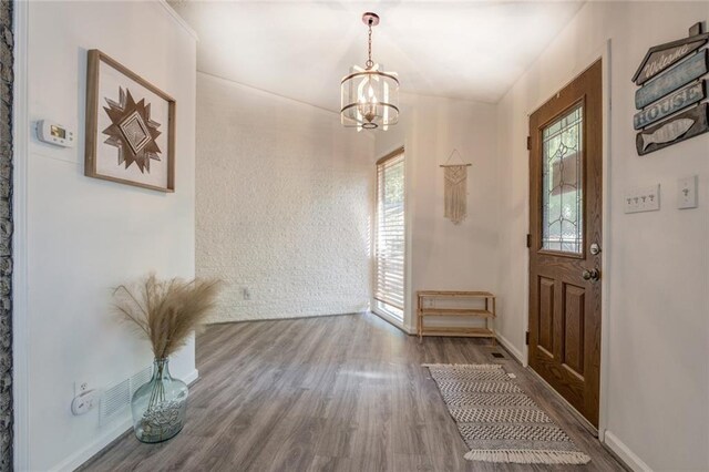 1019 Whippoorwill Rd, Monticello, GA 31064 - foyer entrance with a chandelier and wood finished floors