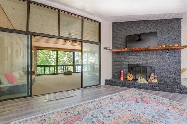 1019 Whippoorwill Rd, Monticello, GA 31064 - living area featuring wood finished floors and a fireplace