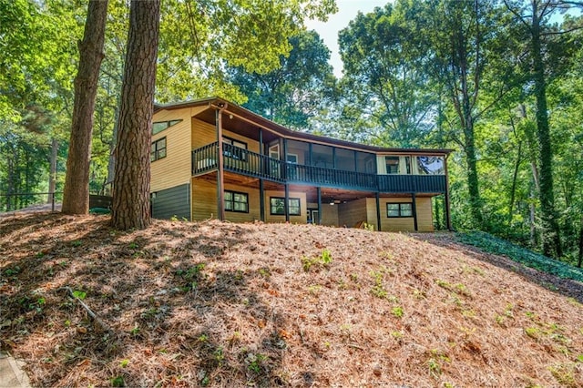 1019 Whippoorwill Rd, Monticello, GA 31064 - back of property featuring a sunroom and a wooden deck