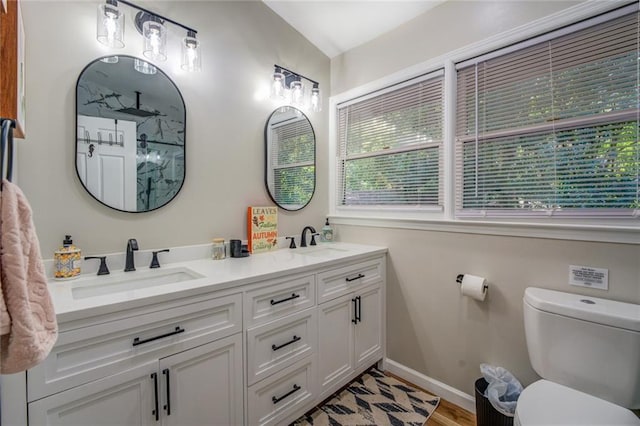 1019 Whippoorwill Rd, Monticello, GA 31064 - full bathroom featuring double vanity, a shower, and wood finished floors