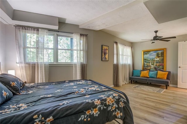 1019 Whippoorwill Rd, Monticello, GA 31064 - bedroom featuring light wood-style flooring, a textured ceiling, and ceiling fan