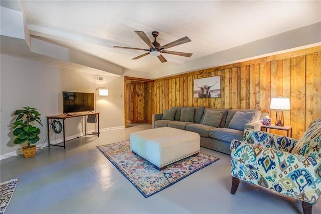 1019 Whippoorwill Rd, Monticello, GA 31064 - living area featuring finished concrete floors, ceiling fan, and wood walls