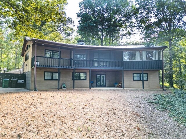 1019 Whippoorwill Rd, Monticello, GA 31064 - view of front facade featuring a sunroom and a chimney