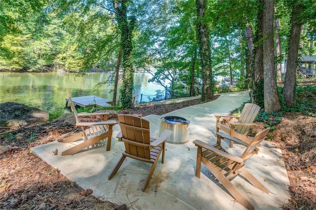 1019 Whippoorwill Rd, Monticello, GA 31064 - view of patio with a water view and a fire pit