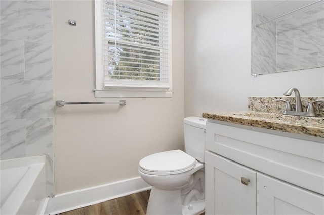 full bathroom with toilet, vanity, hardwood / wood-style floors, and separate shower and tub