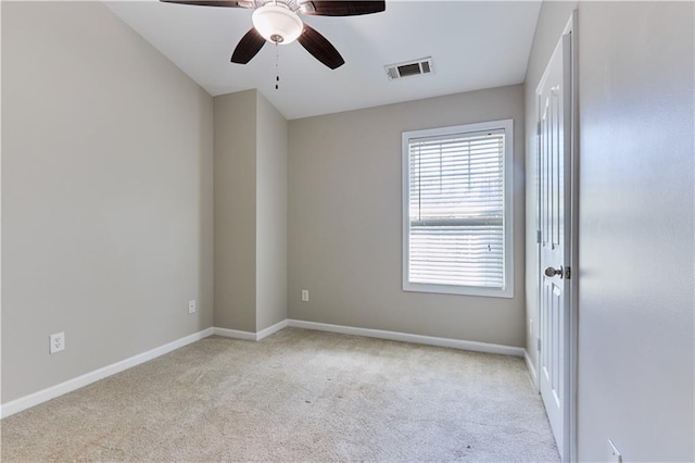 empty room with light colored carpet and ceiling fan