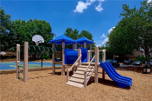 view of playground with basketball hoop