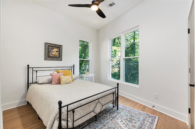 bedroom featuring ceiling fan and hardwood / wood-style flooring