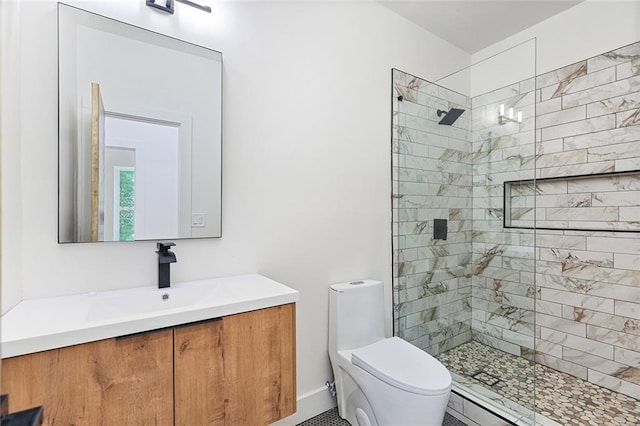 bathroom with toilet, a shower with shower door, and vanity