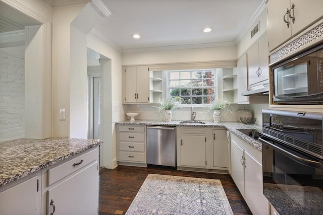 kitchen with light stone countertops, white cabinetry, sink, and black appliances