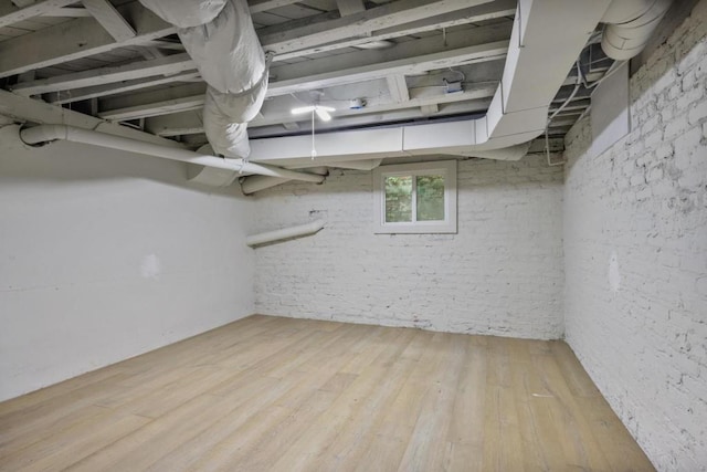 basement featuring wood-type flooring