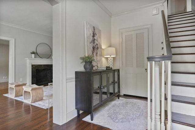 interior space featuring dark hardwood / wood-style floors and ornamental molding