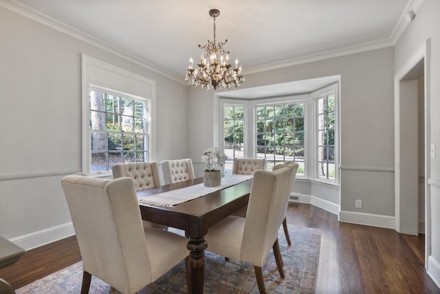 dining room featuring a chandelier, crown molding, and dark wood-type flooring