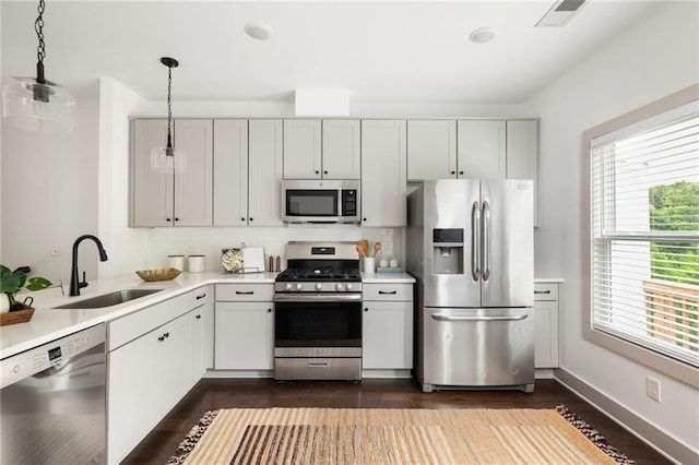 1196 Wylie St SE, Atlanta, GA 30316 - kitchen featuring appliances with stainless steel finishes, a sink, backsplash, and dark wood finished floors