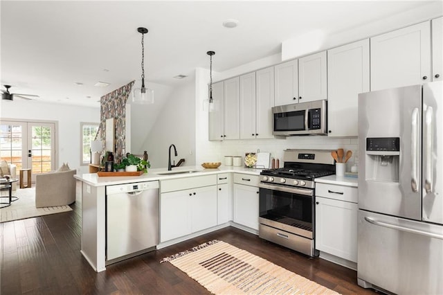 1196 Wylie St SE, Atlanta, GA 30316 - kitchen featuring stainless steel appliances, a sink, a peninsula, open floor plan, and light countertops
