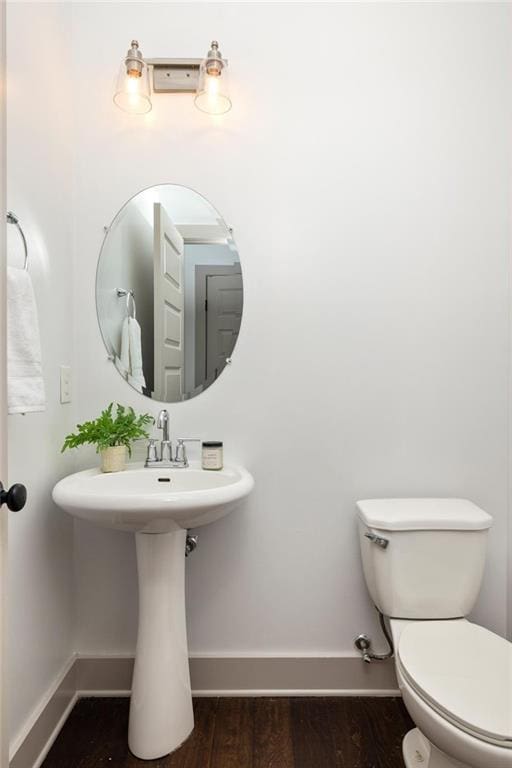 1196 Wylie St SE, Atlanta, GA 30316 - bathroom with toilet, baseboards, wood finished floors, and a sink