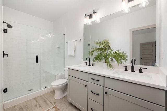 1196 Wylie St SE, Atlanta, GA 30316 - full bath featuring double vanity, a shower stall, toilet, and wood finished floors