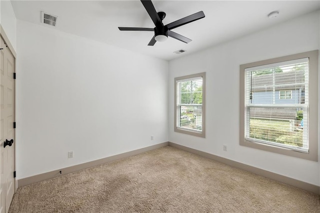 1196 Wylie St SE, Atlanta, GA 30316 - unfurnished room with light carpet, baseboards, ceiling fan, and a smoke detector