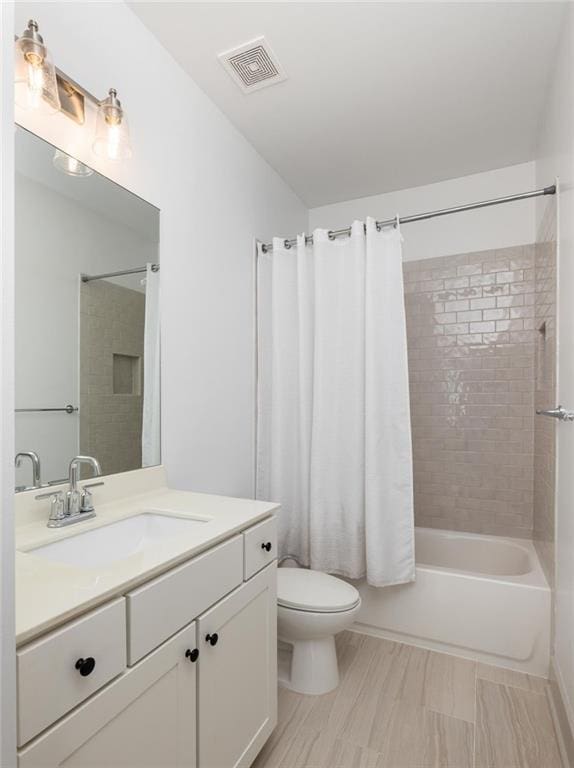 1196 Wylie St SE, Atlanta, GA 30316 - bathroom featuring vanity, toilet, and shower / tub combo with curtain